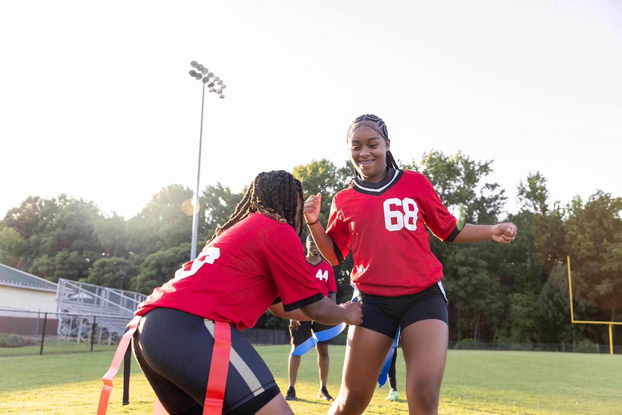 girls flag football team celebrating